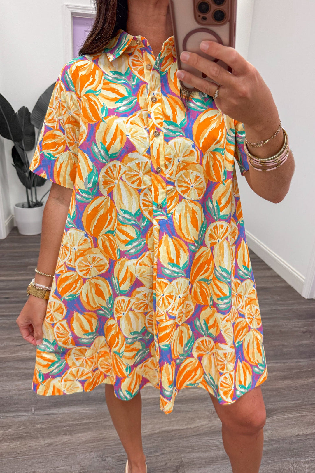 yellow and orange large citrus print button front collared neckline short dress