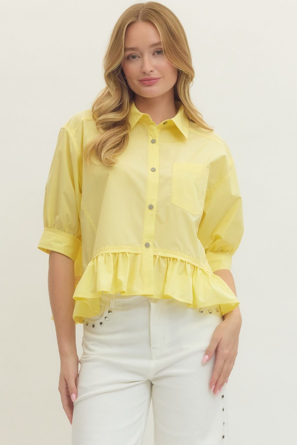 Women's semi-cropped button down yellow peplum top with ruffled hem by Entro