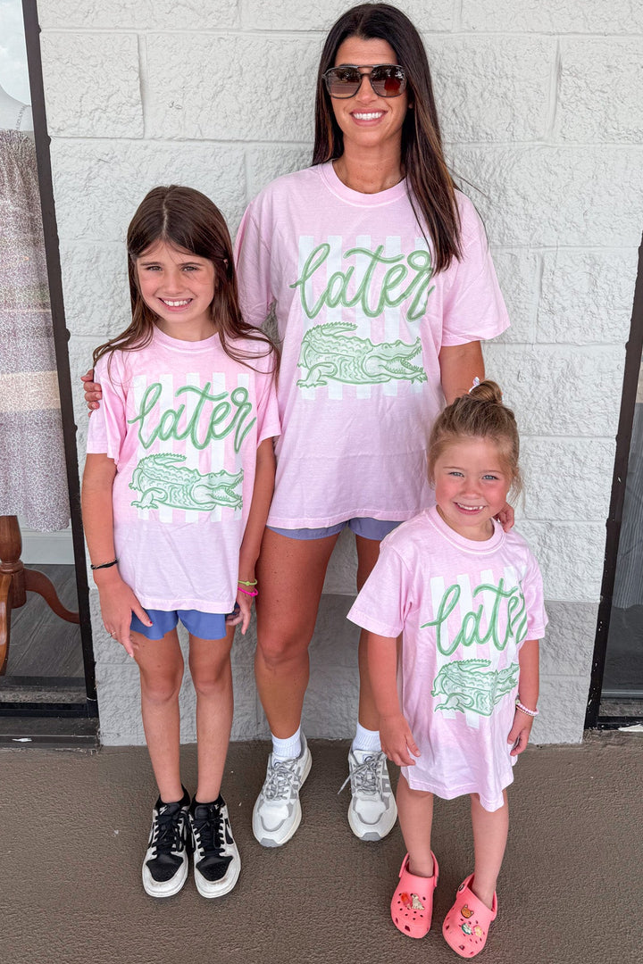 youth light pink with white stripes and green later gator graphic print short sleeve tee